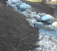 Stone waterfall into pond