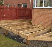 During build of garden decking beside conservatory