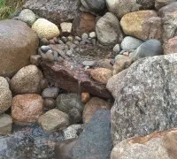 Stone waterfall with pebbles