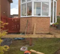 Start of garden decking beside conservatory